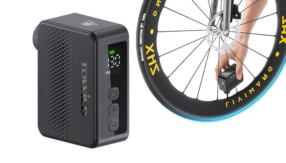 Towild A13 mini electric bike pump inflating a road bike tire. Shows the real-time digital pressure display set to 130 PSI, demonstrating high-pressure capability and compact handheld operation.