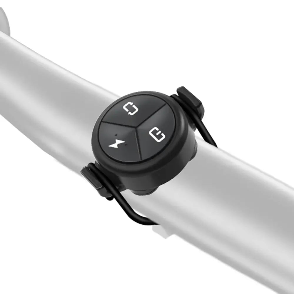 The TOWILD ALC-01 remote mounted securely on a bicycle handlebar with the included o-ring strap.