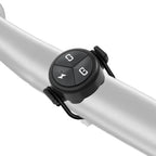 The TOWILD ALC-01 remote mounted securely on a bicycle handlebar with the included o-ring strap.