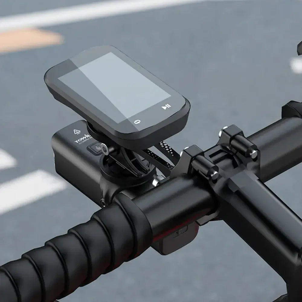 A top-down view of a professional cockpit setup using the TOWILD AS80 stem mount, showing a bike computer and a TOWILD light perfectly aligned and centered.