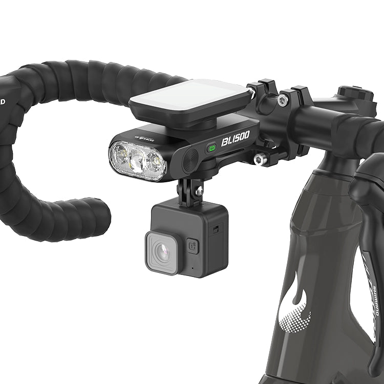 TOWILD BL1500 stacked below a bike computer and above an action camera on a road-bike cockpit.