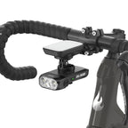TOWILD BL1500 mounted below a bike computer on an out-front road-bike extension mount.