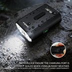 TOWILD BL900 road bike light performing reliably in heavy rain, demonstrating its IPX6 waterproof capability and securely sealed Type-C charging port.