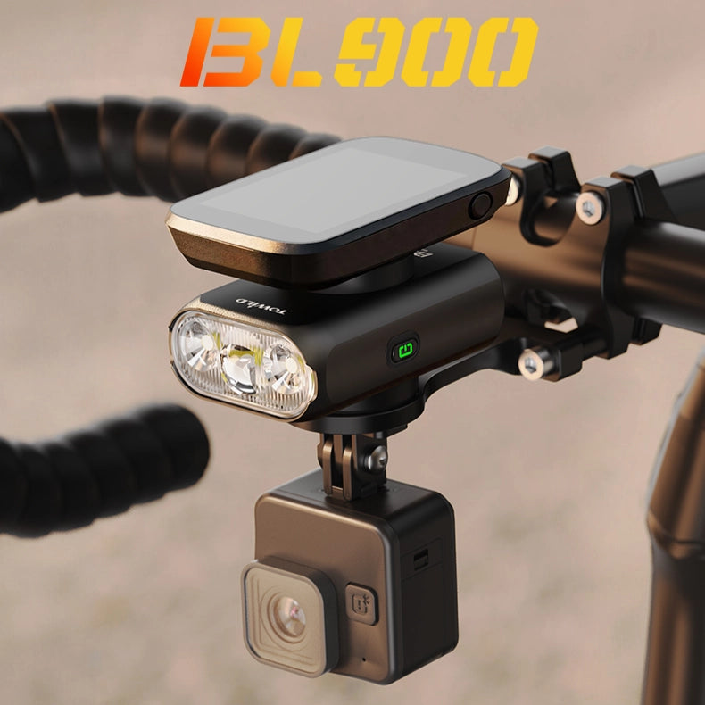 TOWILD BL900 bike light neatly mounted under a cycling computer with an action camera attached below, showcasing a clean, aerodynamic road bike cockpit.