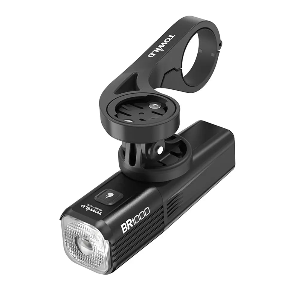 The Towild BR1000 bike light installed in an underslung position on the AS90 out-front mount, showcasing the clean cockpit setup possible with its GoPro-compatible base.