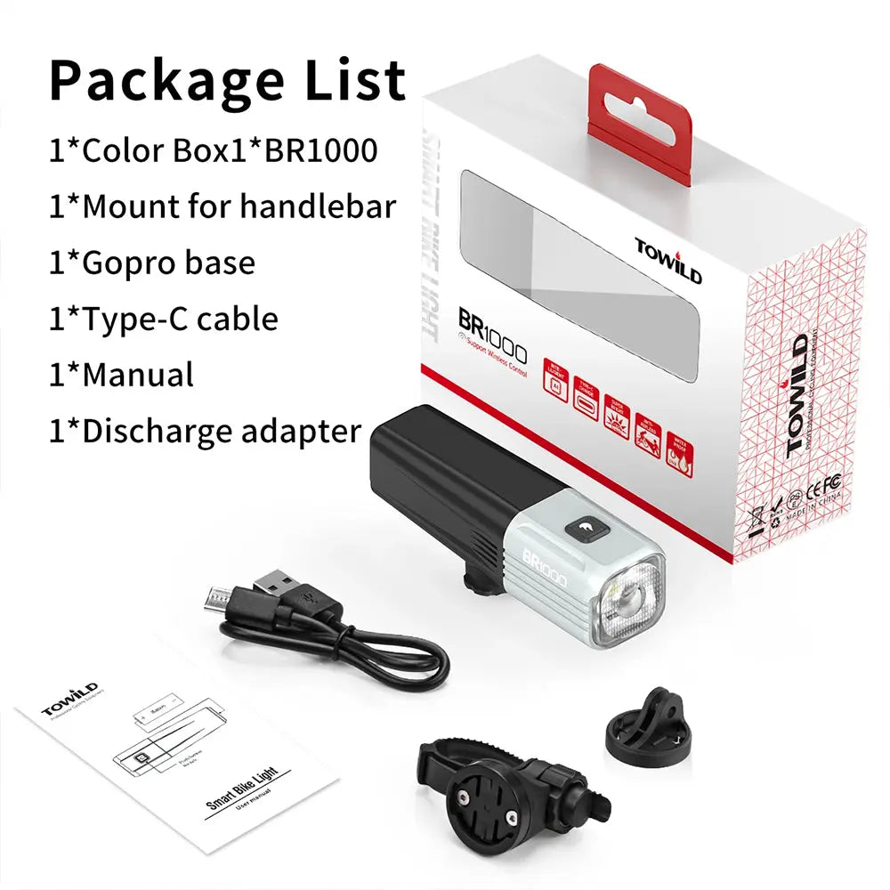 The complete package contents for the Towild BR1000 bike light kit, showing the light, retail box, handlebar mount, GoPro base, and Type-C charging cable.