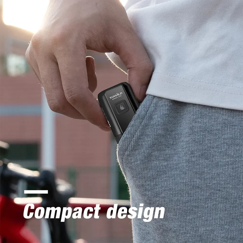 The compact TOWILD BR800s bike light being easily placed into a pocket, highlighting its portable design.