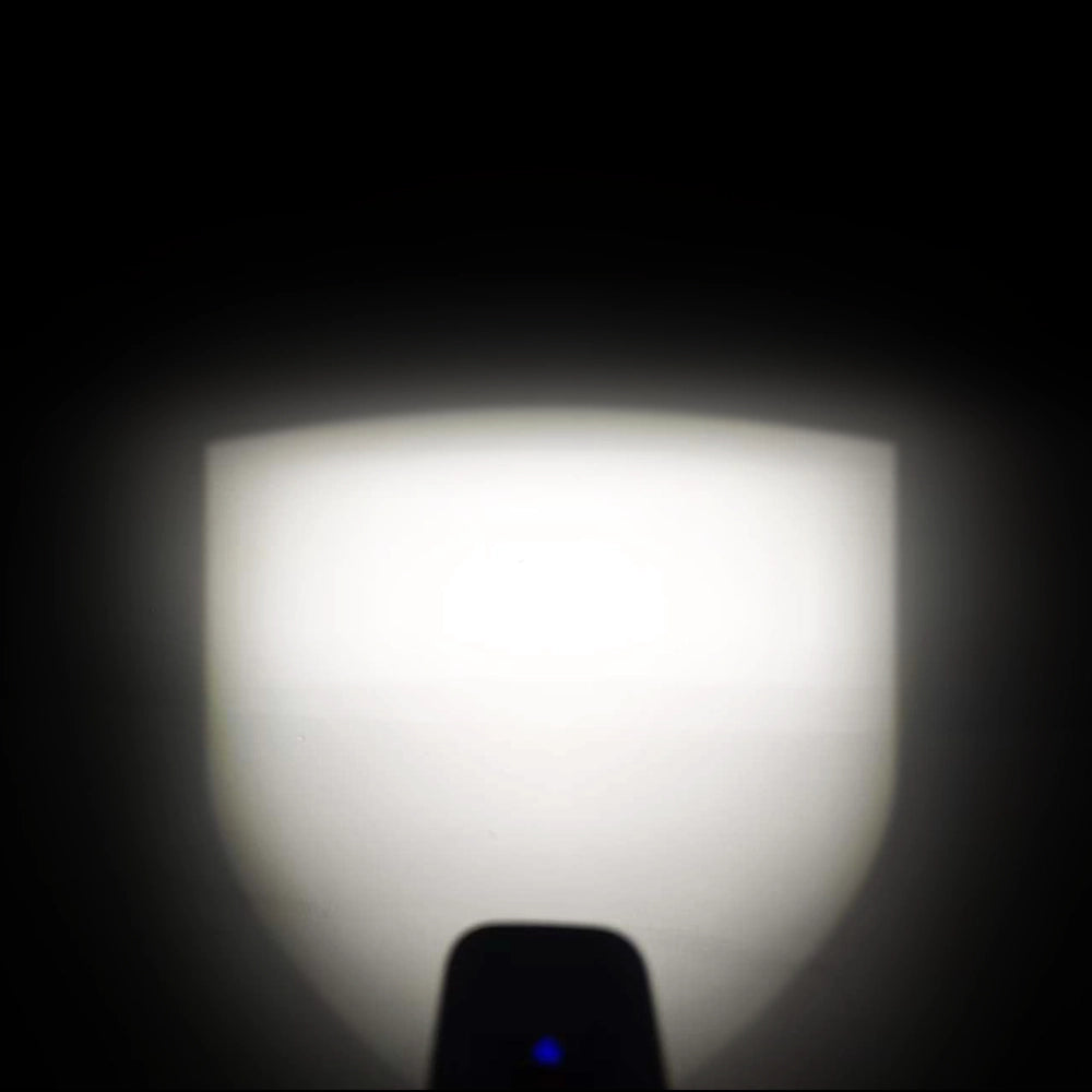 Night test beam shot of Towild CL series bike light. Demonstrates the wide, even floodlight and clear cut-off line effect on a dark wall.