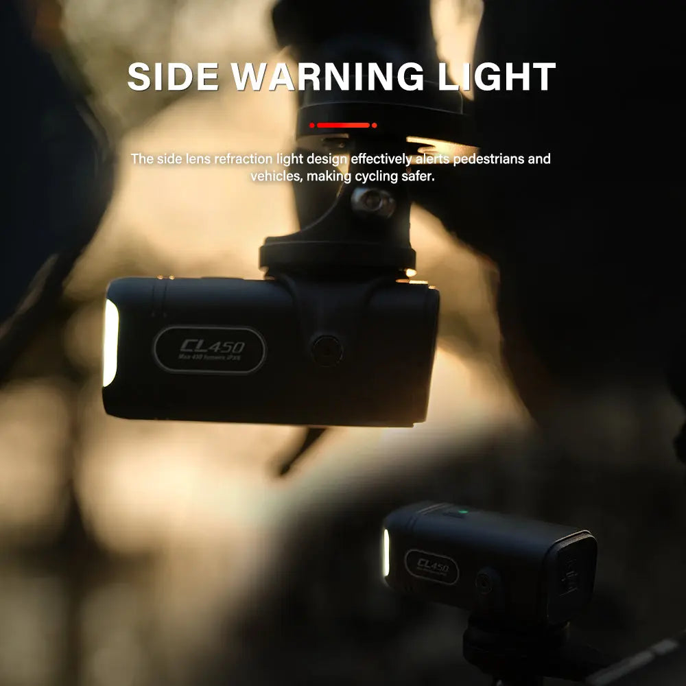 Promotional image of the TOWILD CL450 bike light at dusk, with its side warning light actively illuminated to alert pedestrians and vehicles for enhanced cycling safety.