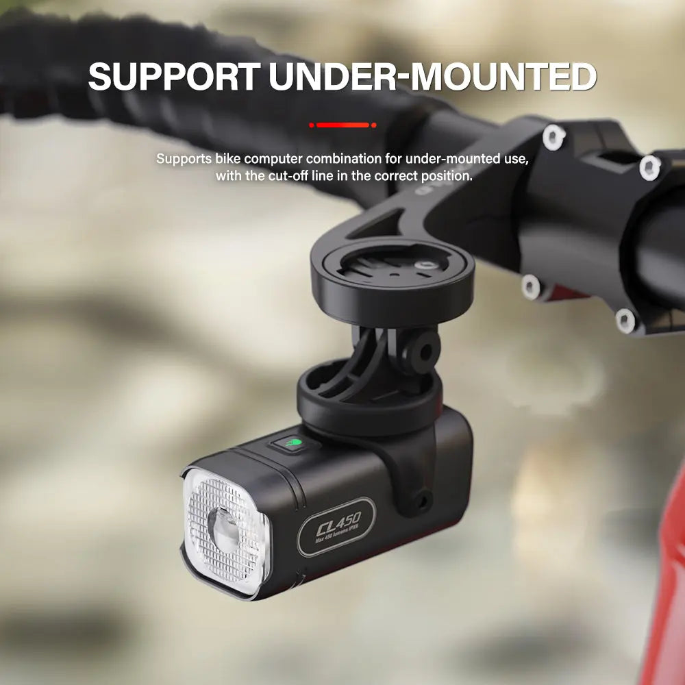 Image of the TOWILD CL450 bike light under-mounted beneath a bike computer mount, showcasing a clean handlebar setup and how the anti-glare cut-off line remains effective.