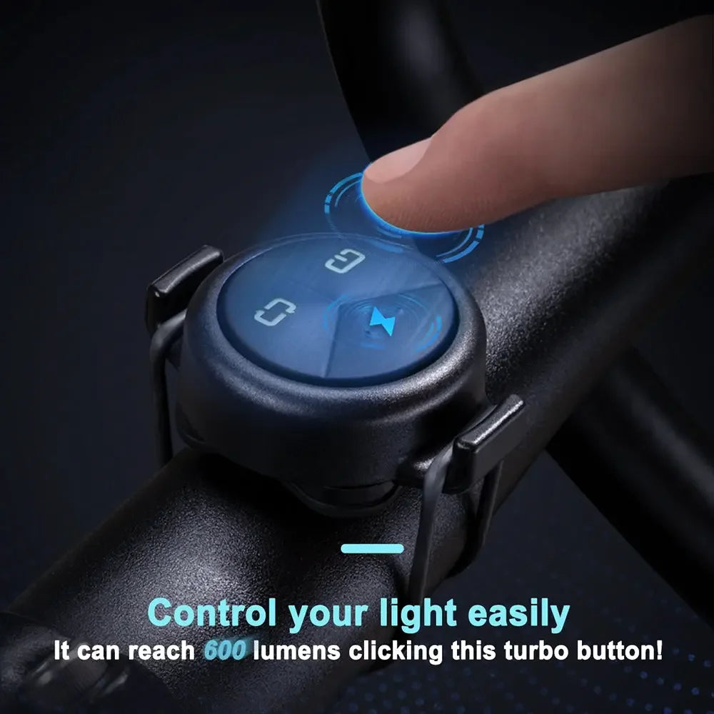 A close-up showing a finger pressing the turbo button on the wireless remote for the TOWILD CL600, which instantly activates the maximum 600 lumens brightness.