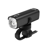 A studio shot of the black TOWILD CL600 smart commuter bike light, showing its StVZO-style anti-glare lens and the standard handlebar mount.