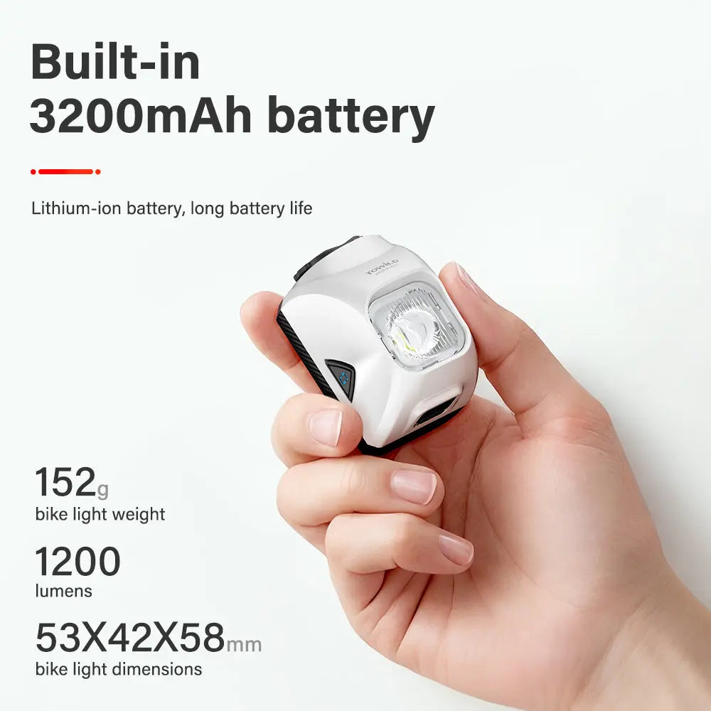 A hand holding the compact, white Towild DL1200S aero bike light, with its key specifications listed: 3200mAh battery, 152g weight, and 1200 lumens.
