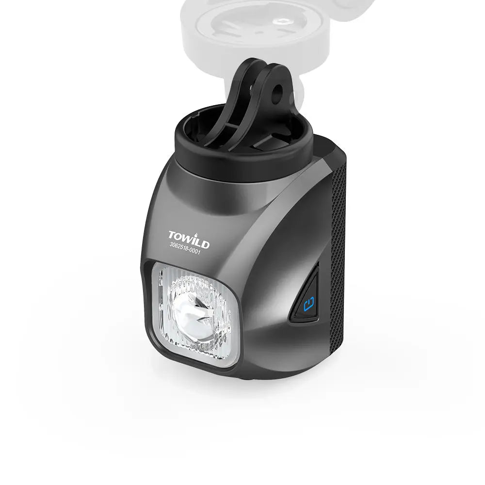 The black Towild DL1200S bike light shown with its included GoPro-compatible adapter, allowing for versatile underslung mounting on out-front mounts.