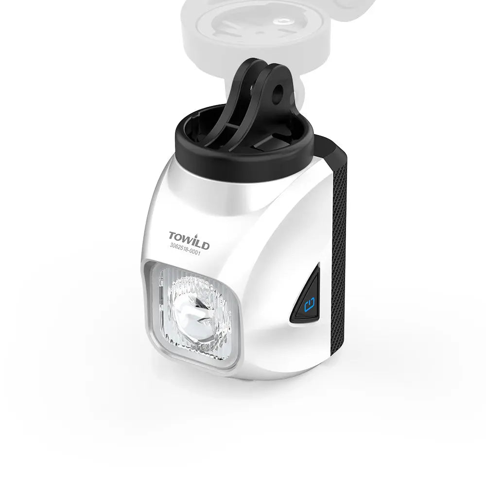 The white Towild DL1200S bike light shown with its included GoPro-compatible adapter, allowing for versatile underslung mounting on out-front mounts.