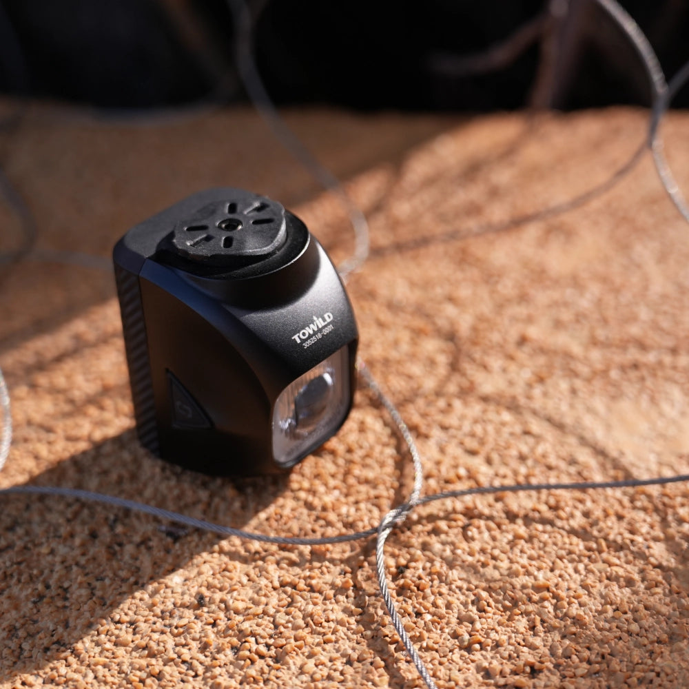 Close-up of Towild DL1200S inverted optical lens and GoPro mounting interface. Designed specifically for hanging installation with optimized anti-glare beam pattern.