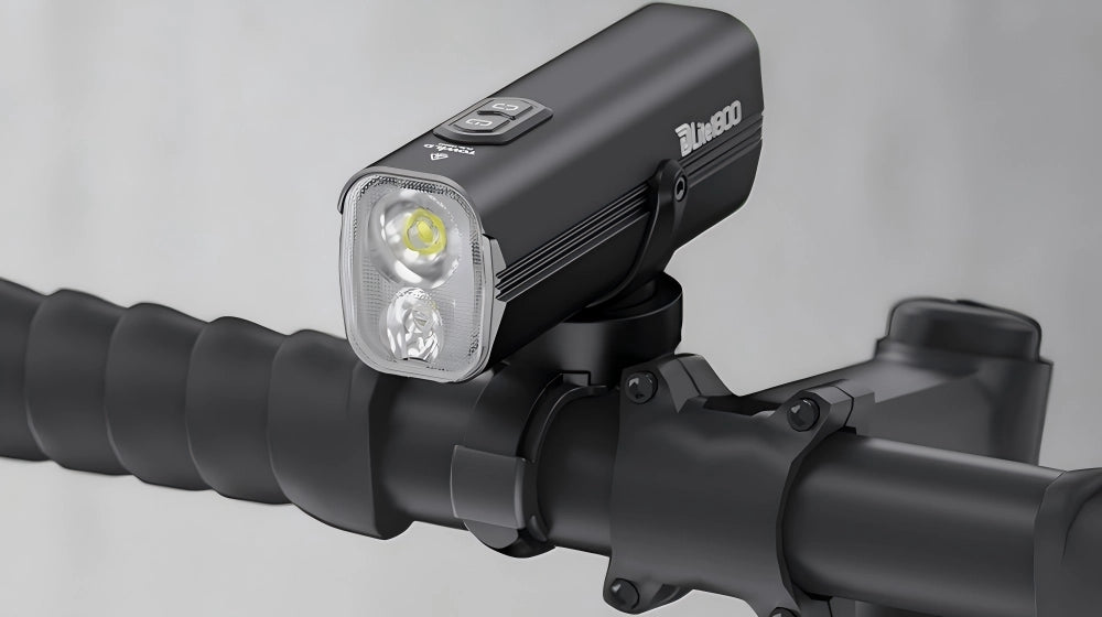 Side profile of Towild DLite 1800 on a bike. Showcases the sleek aluminum heat sink fins designed for efficient cooling during high-lumen output.