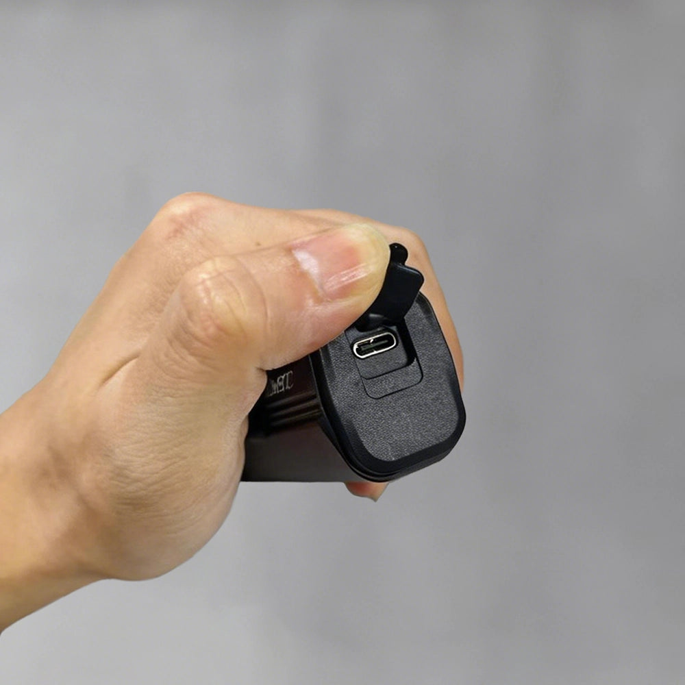 Hand opening the USB-C port cover on Towild DLite 1800. Supports fast charging and reverse discharging to function as a 5000mAh power bank.