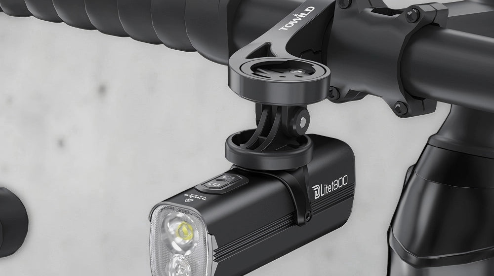 Towild DLite 1800 mounted underneath a bike handlebar using the GoPro adapter. Demonstrates a clean, aerodynamic cockpit setup ideal for road and gravel cycling.