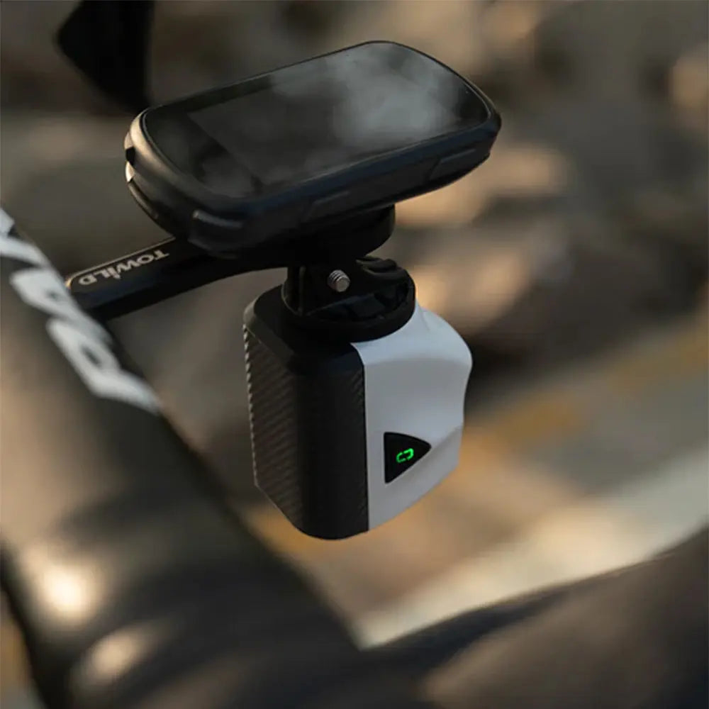 The white Towild DLite1700 bike light installed in a clean, underslung position on an out-front computer mount, showcasing a professional and aerodynamic cockpit setup.