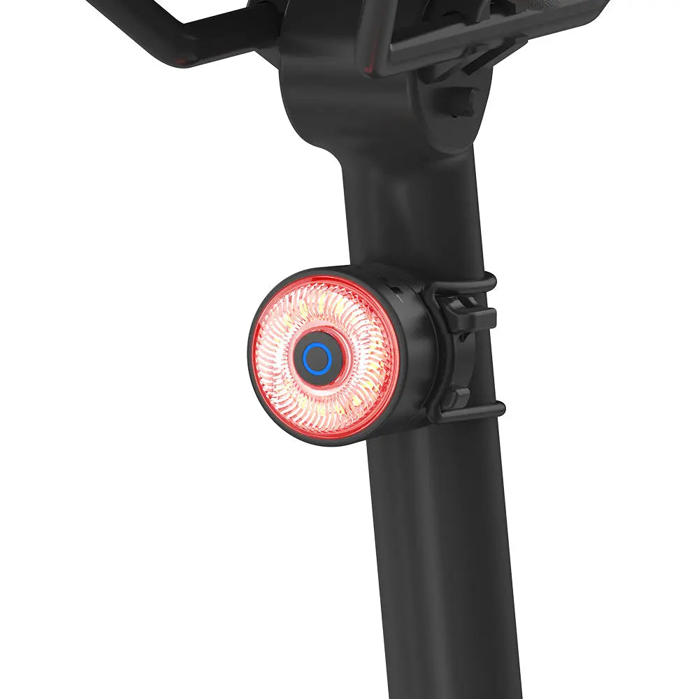 A cyclist's view of the TOWILD TL03 Pro colorful tail light active on a seatpost.