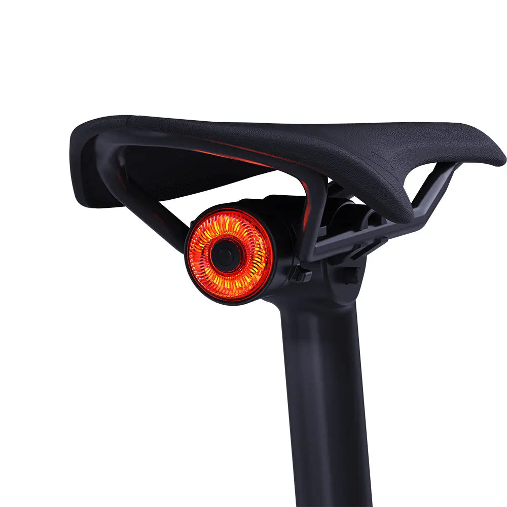  TOWILD TL03 rear bike light installed securely under a bicycle saddle