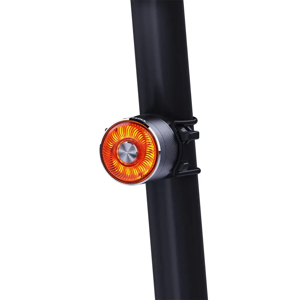 The TOWILD TL05 aluminum smart tail light mounted securely on a black bicycle seat post.