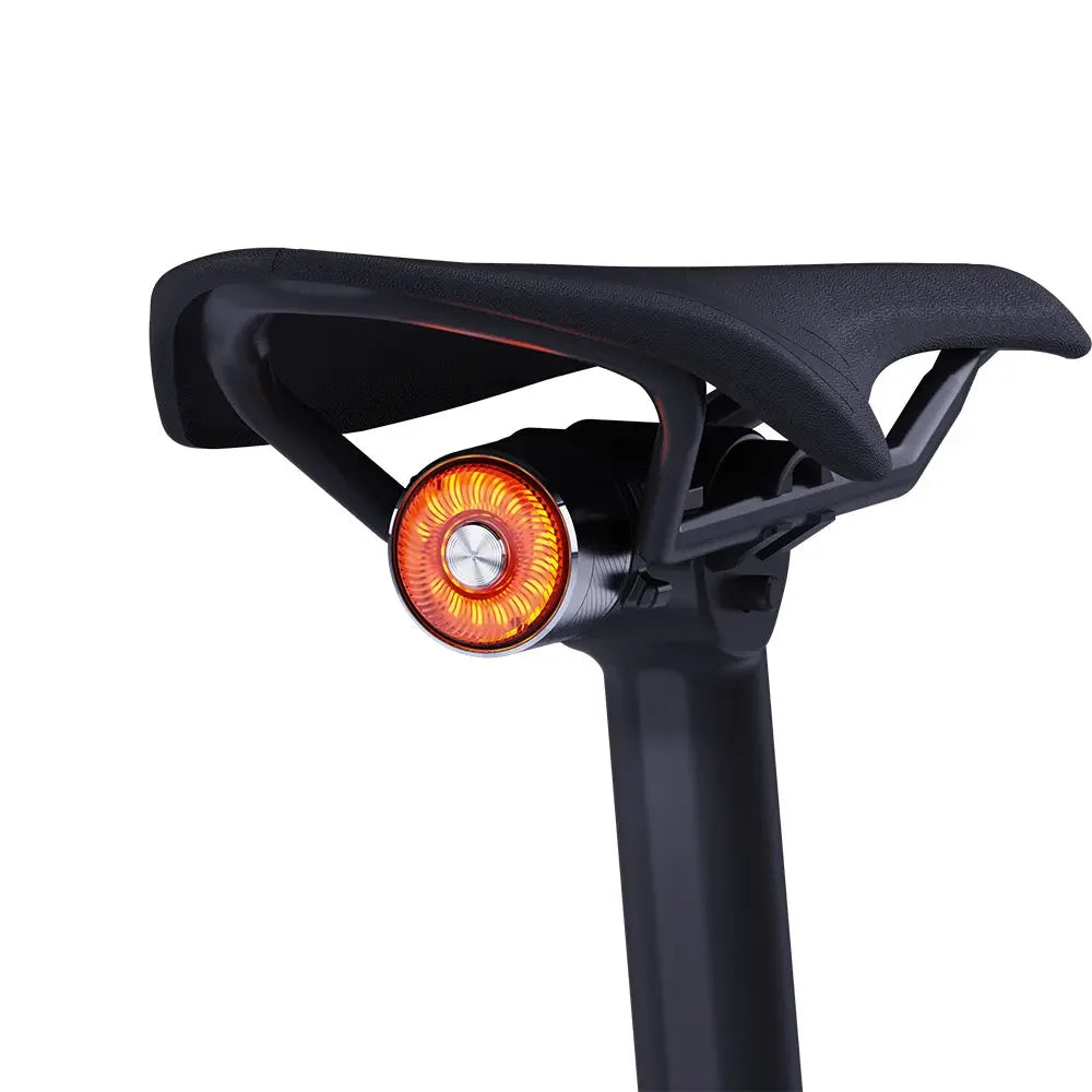 The compact TOWILD TL05 aluminum tail light fitted neatly under a bicycle saddle.