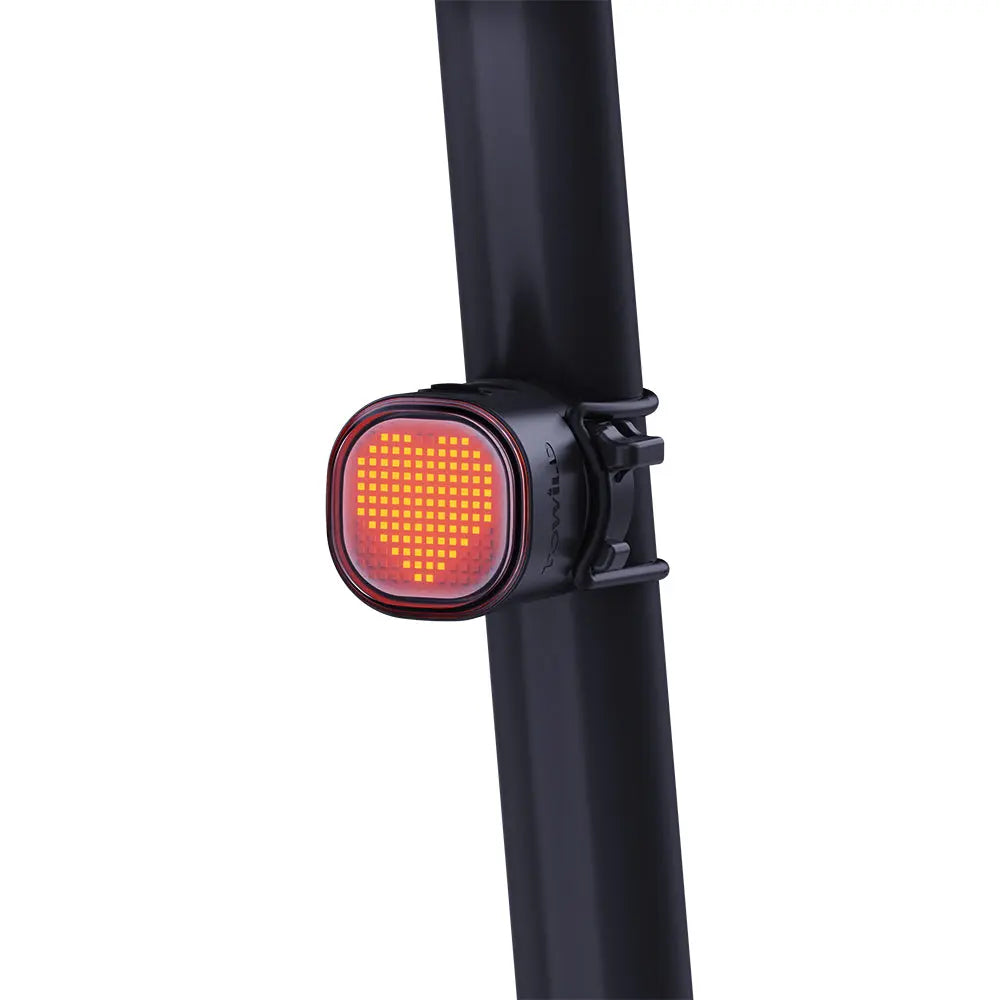 A glowing yellow heart animation displayed on the TOWILD TL08 DIY tail light, which is mounted on a seatpost.