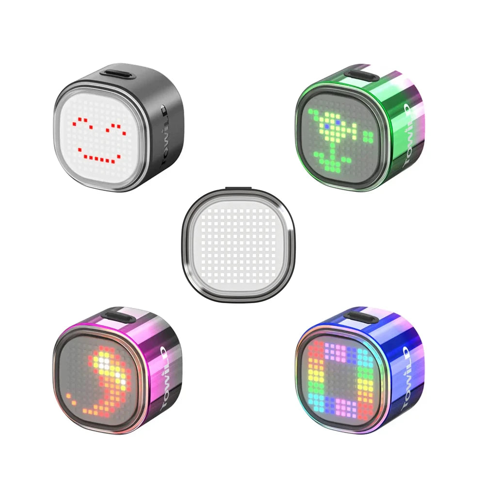 The complete collection of TOWILD TL08 DIY programmable bike tail lights, showcasing the four available color options—black, green/pink gradient, purple/black gradient, and blue/pink gradient—each displaying a unique custom pixel art animation.