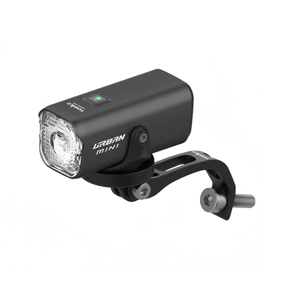 The compact TOWILD Urban Mini commuter bike light with its anti-glare cut-off lens, displayed on its custom aluminum fork mount designed for Brompton folding bikes.