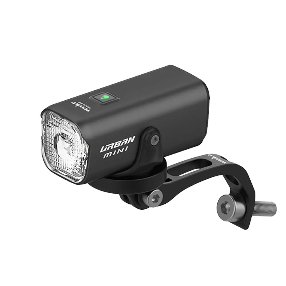 TOWILD Urban Mini front bike light shown with its custom aluminum mounting bracket for Brompton folding bikes.